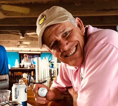 Peter Walsh holding a golf ball at a bar