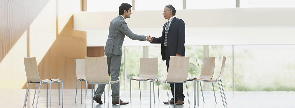 Two men shaking hands.