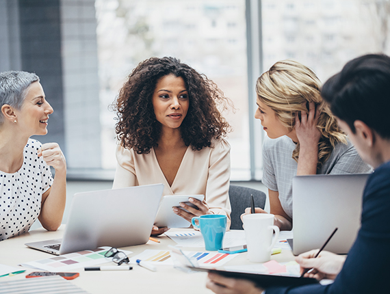 Group of female professionals sitting at a table