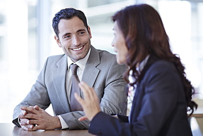 Businessman and businesswoman talking