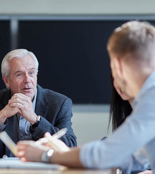 Business people talking in a meeting.