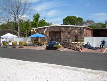 A long-distance shot of racecars on display.