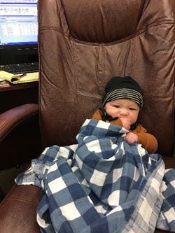 Baby Cuddled up with Blanket