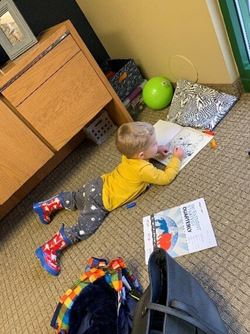 Young Boy Coloring on Floor
