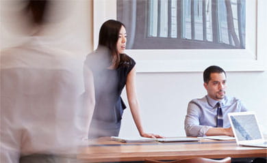 Business people at work in a busy luxury office space