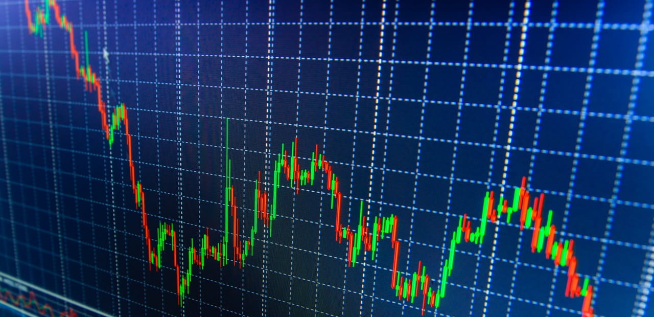 Stock market data projected onto a blue-colored screen