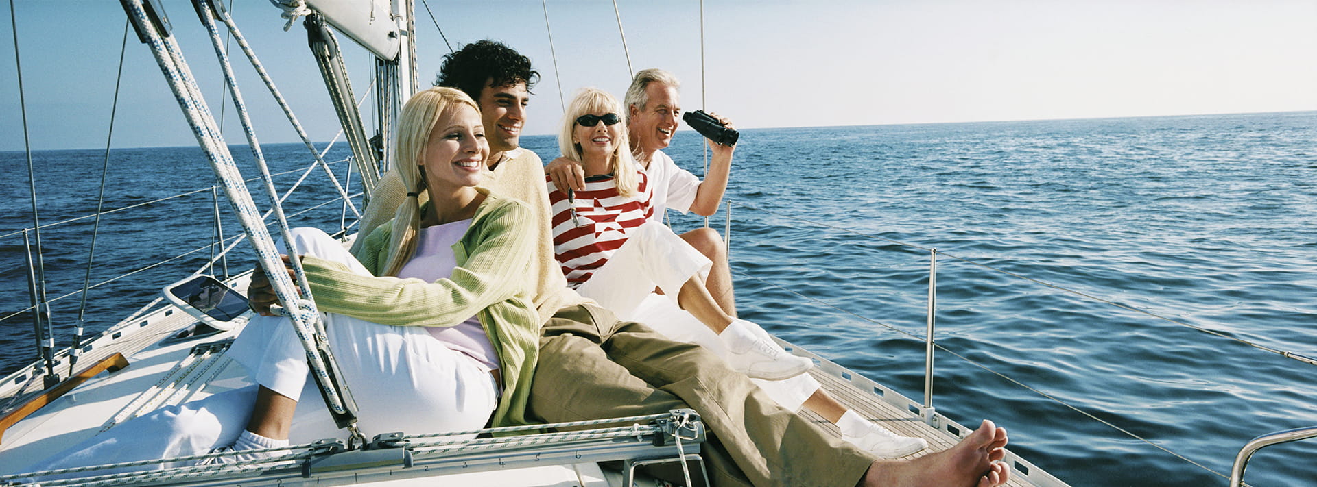 Family sitting on boat deck