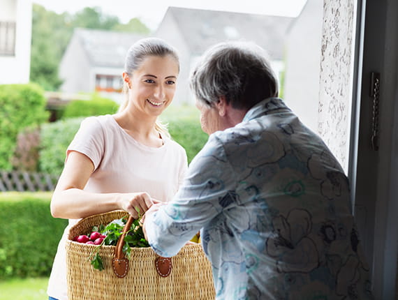 Young woman delivering groceries