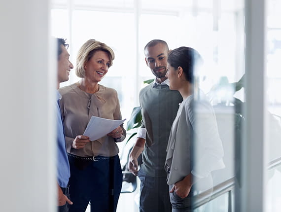 Female professional talking to young couple