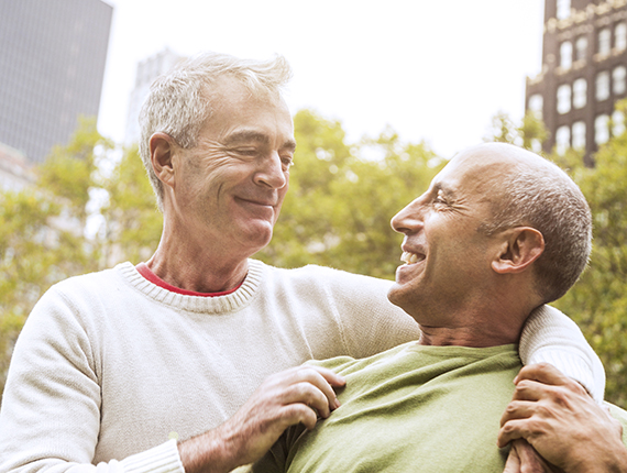 Mature male couple smiling