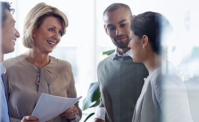 Female professional talking to young couple