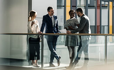 business people talking in hallway