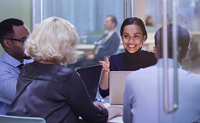 people meeting with laptops