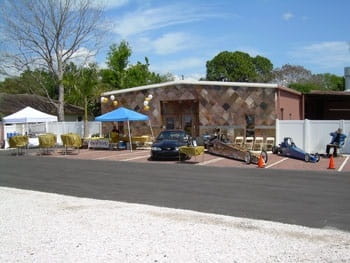 A long-distance shot of racecars on display.