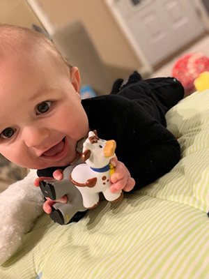 Baby Roman smiling to the camera