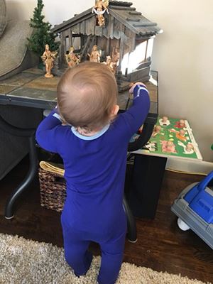 Baby playing with Nativity Scene