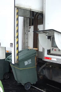 Green bin being loaded for Earth Day item shredding.