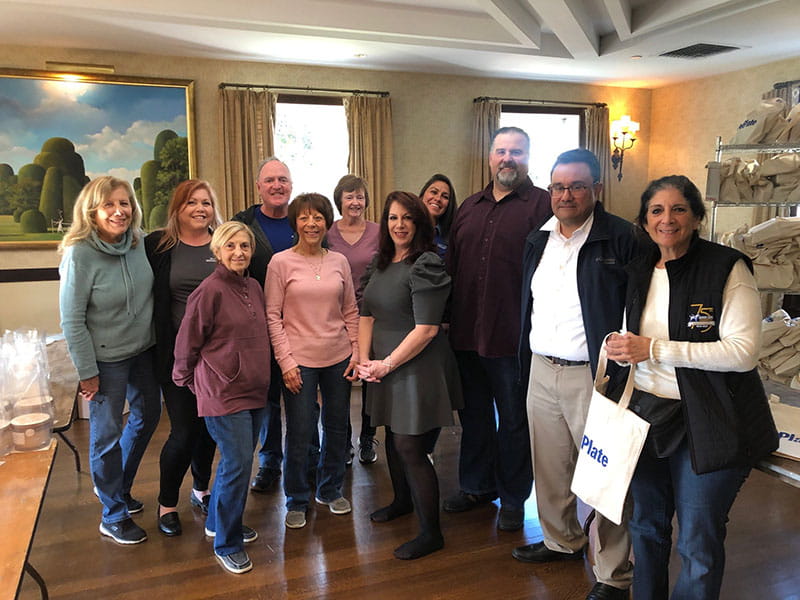 Volunteers of event sponsor Hendel Wealth Management Group join together with Guide Dog Foundation of Long Island volunteers in support of the organizations' event