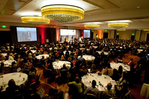 East Bay Women's Conference room full of people.