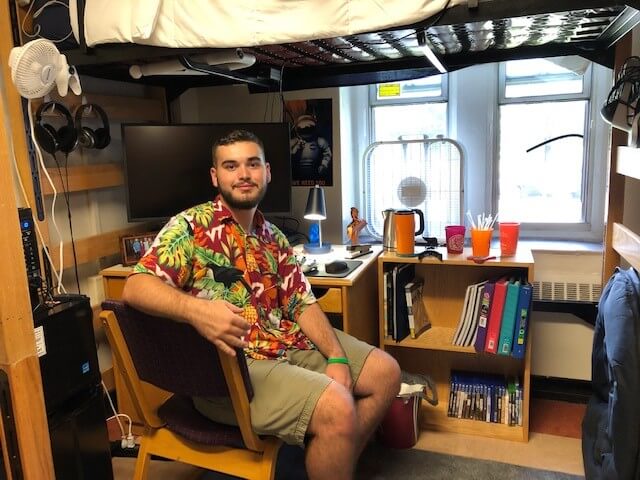 Clay in his dorm room