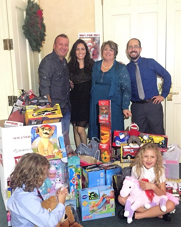 That's a wrap! Mick Graham & Associates gathered at the Baytree Residents' Party 2016. All donations went to Toys for Tots.