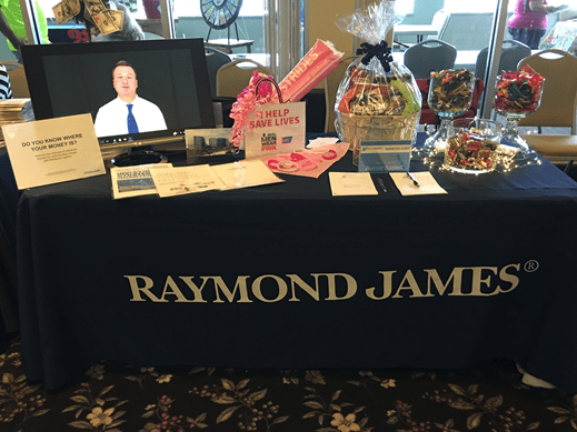 Mick Graham's Raymond James table is set up for Baby Boomers, an event!