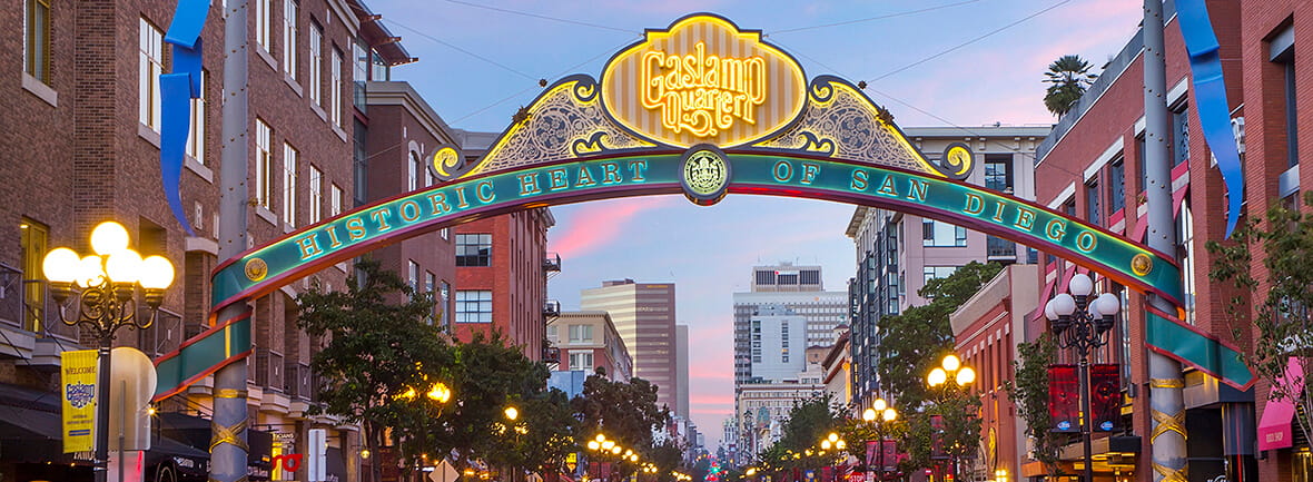 Downtown San Diego Gaslamp sign over moving traffic