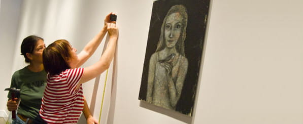 Meet Karen - woman hanging painting