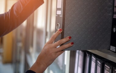 Woman's Hand Holds Document File