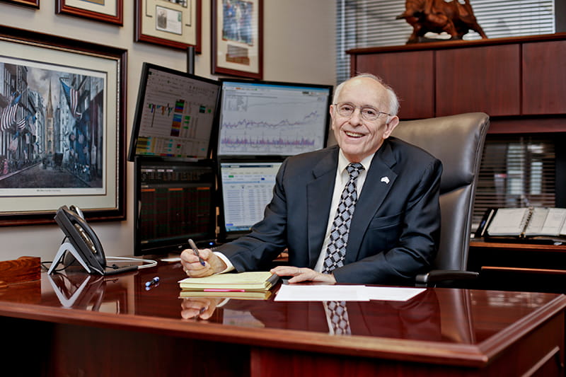Malcolm at his desk