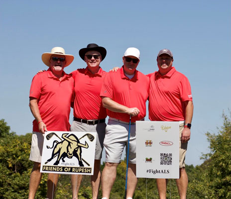 group with sponsor signs