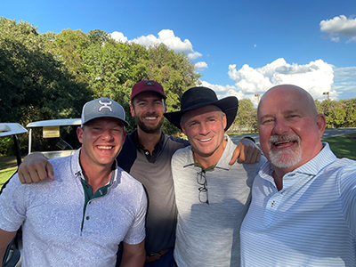 Group picture of Zach and three other men.