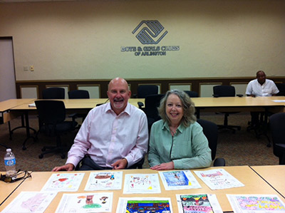 First Step in the Process: Zach Scott and Lori Lake judge the children's art for the Thanksgiving card contest in August 2014.