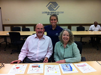 Alexis Ouart, daughter of Patti Ouart, Director of Development at the Boys & Girls Club of Arlington, helps Zach and Lori organize and judge the drawings.