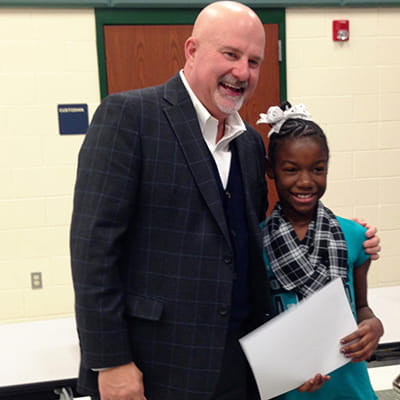 Zach presented Elon with her first place award certificate.