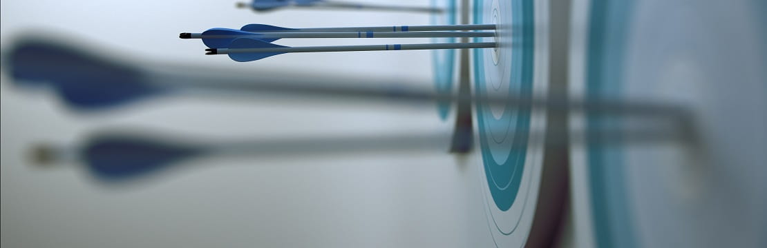 Row of archery targets from right to left with arrows piercing through the bullseye mark