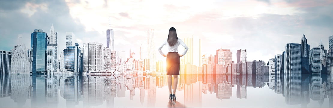 Woman looking off into the horizon surrounded by a city skyline