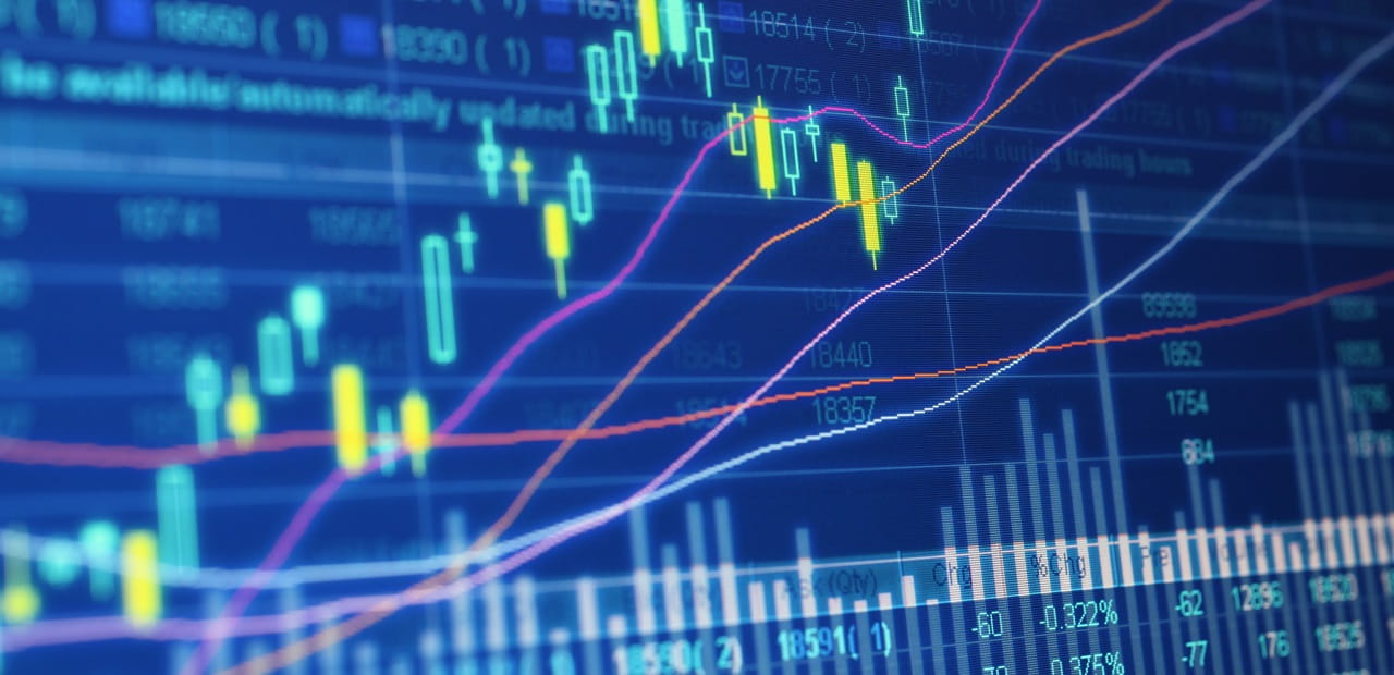 Stock market data projected onto a blue-colored screen