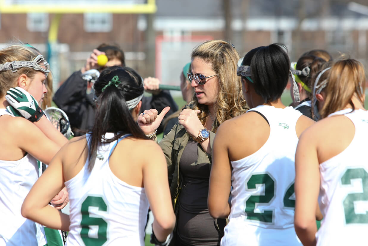 Cristina coaching a college lacrosse team. Photo courtesy of Wagner Athletics.